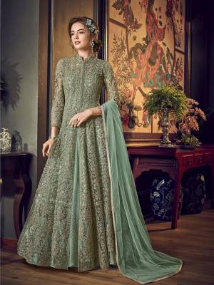 Look Pretty In This Subtle Shade Of Green That With This Designer Indo-Western Pair In Pastel Green Color. Its Top IS Fabricated On Net Bautified With Heavy Embroiderey Comes With A Fancy Crushed Satin Inner Paired With Santoon Bottom And Chiffon Fabricated Dupatta. 