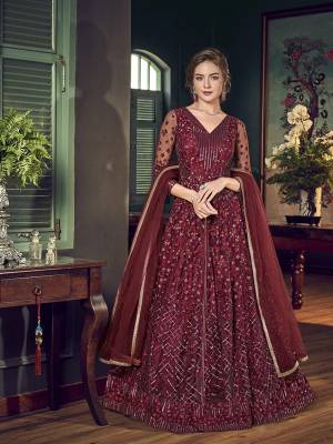For A Royal Look, Grab This Lovely Maroon Colored Ino Westen pair Which Comes With Pants And Lehenga. Its Top IS Net Based Paired With Satin Lehenga And Chiffon Fabricated Dupatta. For A More Trendy Look, You can Pair Up With Its Lovely Embrodered Santoon Fabricated Pants. 