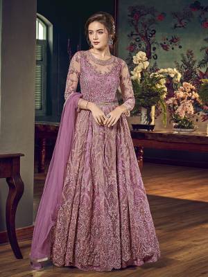 Look Pretty In This Pretty Shade Of Pink That With This Designer Indo-Western Pair In Mauve Pink Color. Its Top IS Fabricated On Net Bautified With Heavy Embroiderey Comes With A Satin Inner Paired With Santoon Bottom And Chiffon Fabricated Dupatta. 