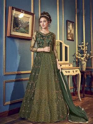 For The Upcoming Wedding And Festive Season,  Grab This Very Beautiful And Heavy Designer Indo-Western Dress In Pine Green Color. Its Top IS Fabricated On Net And Satin Paired With Santoon Bottom And chiffon Fabricated Dupatta. Also It Has A Satin Fabricated Lehenga , so That You Can Pair With Any Of The Bottoms As Per The Occasion. 