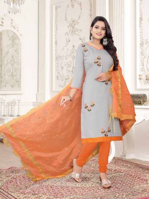 Here Is A Pretty Dress Material For Your Casual Or Semi-Casual Wear In Grey And Orange Color. Its Top Is Fabricated On Cotton Slub Paired With Cotton Bottom And Cotton Silk Fabricated Dupatta. Get This Stitched As Per Your Desired Fit And Comfort.