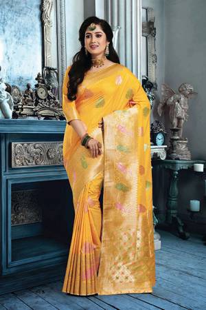 Celebrate This Festive Season Wearing This Pretty Sillk Based Saree In Yellow Color Paired With Yellow Colored Blouse. This Saree And Blouse Are Fabricated On Art Silk Beautified With Weave All Over. 