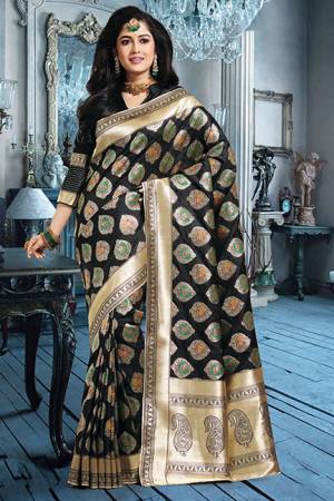 For A Bold And Beautiful Look, Grab This Silk Based Black Colored Saree Paired With Black Colored Blouse. Its Rich Art Silk Fabricated Saree Is Beautified With Detailed Weave. 