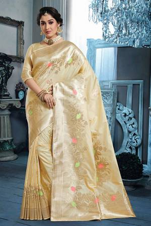 Flaunt Your Rich And Elegant Taste Wearing This Designer Silk Based Saree In Cream Color Paired With Cream Colored Blouse. Its Elegant Color And Rich Silk Fabric Will Earn You Lots Of Compliments From Onlookers. 