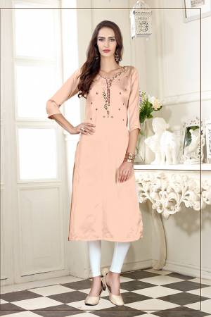 A Must Have Shade In Every Womens Wardrobe Is Here With This Readymade Straight Kurti In Light Peach Color. This Kurti Is Fabricated On Soft Satin Silk Beautified With Subtle Thread work. 