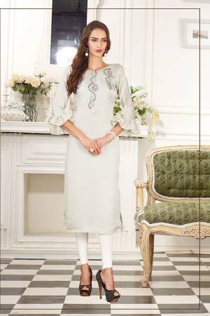 Simple And Elegant Looking Designer Straight Kurti IS Here In Off-White Color Fabricated On Soft Satin Silk. This Pretty Kurti Can Be Paired With Same Of Contrasting Colored Leggings Or Pants. Also Its Fabric Ensures Superb Comfort All Day Long. 