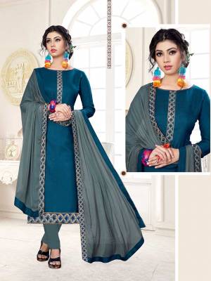 Rich And Elegant Looking Dress Material Is Here In Blue Color Paired With Contrasting Grey Colored Bottom And Dupatta. Its Top Is Fabricated on Cotton Slub Paired With Cotton Bottom And Chiffon Fabricated Dupatta. 