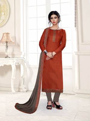 Enhance Your Personality Wearing This Designer Straight Suit In Rust Orange Color Paired With Contrasting Grey Colored Bottom and Dupatta. This Dress Material Is Cotton Based Paired With Chiffon Fabricated Dupatta. Buy This Dress Material Now.