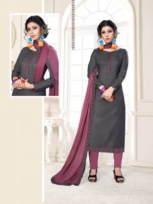 If Those Readymade Suit Does Not Lend You The Desired Comfort Than Grab This Cotton based Dress Material With Chiffon Dupatta And Get This Stitched As Per Your Desired Fit And Comfort. Its Top IS In Dark Grey Color Paired With Contrasting Mauve Pink Colored Bottom and Dupatta. Buy Now.