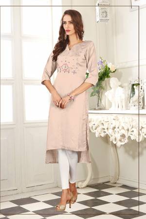 For Your Semi-Casuals, Grab This Readymade Pretty Kurti In Pastel Peach Color Fabricated On Soft Satin Silk. It Is Beautified With Contrasting Thread Work and Also It Is Light Weight And Easy To Carry All Day Long. 