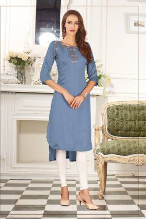 Look Pretty In This Readymade High Low Patterend Straight Kurti In Blue Color. It Is Fabricated On Soft Satin Silk Beautified With Thread Work. 