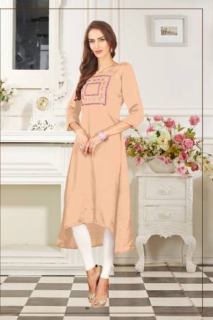 Add This Lovely Color To Your Wardrobe In Peach Colored Readymade Kurti Fabricated On Soft Satin Silk. Its Fabric Is Soft Towards Skin And Easy To Carry All Day Long. 