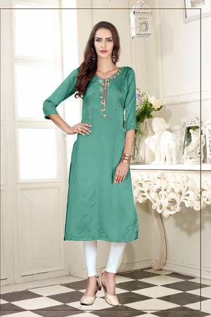 A Must Have Shade In Every Womens Wardrobe Is Here With This Readymade Straight Kurti In Light Sea Green Color. This Kurti Is Fabricated On Soft Satin Silk Beautified With Subtle Thread work. 