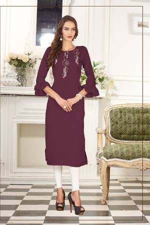 Simple And Elegant Looking Designer Straight Kurti IS Here In Wine Color Fabricated On Soft Satin Silk. This Pretty Kurti Can Be Paired With Same Of Contrasting Colored Leggings Or Pants. Also Its Fabric Ensures Superb Comfort All Day Long. 