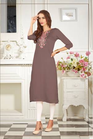 A Must Have Shade In Every Womens Wardrobe Is Here With This Readymade Straight Kurti In Mauve  Color. This Kurti Is Fabricated On Soft Satin Silk Beautified With Subtle Thread work. 