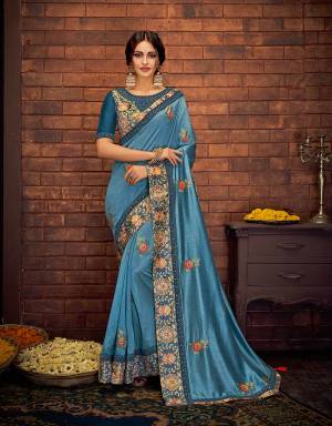 Be prepared to look your attractive best in this gorgeous blue saree with intricate print and embroidery details. Complete the look by adorning statement jhumkis and a bindi . 