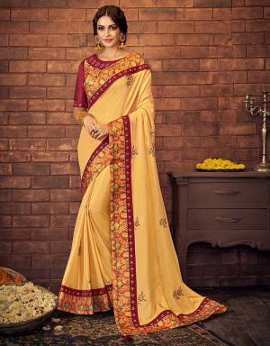 Embellished with ornate embroideries and intricate digital prints, this lustrous yellow saree is a refined pick for the traditional festivities . 