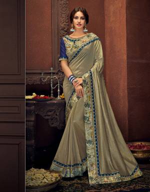 Exude a youthful appeal in this dual tone grey-blue saree beautiful with subtle floral details . Pair with bold gold jhumkis to give that old-world vibe. 