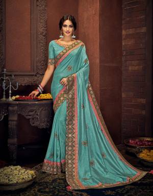 This modest and refined blue saree paired with royal brocade and combined with a hint of pink will make your ethnic soul flutter with joy. Drape in a classic nivi drape and look mesmerizing. 