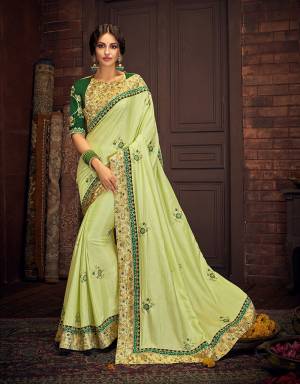 This light and bright saree in surreal shades of green makes for a perfect choice for the traditional events . Pair with oxidized gold jewelry to exude a vintage vibe
