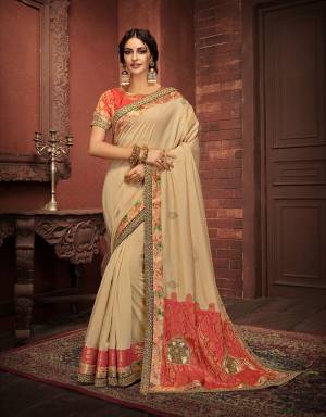 Sync to the tunes of the elegance of our traditions and let of those rhytmic vibes in this muted saree enhanced with a right touch of red . 