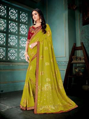 Grab This Saree For Your Semi-Casuals In Pear Green Color Paired With Maroon Colored Blouse. This Saree And Blouse are Silk Based Beautified With Prints And Thread Embroidery. It Is Light In Weight And Easy To Carry All Day Long. 