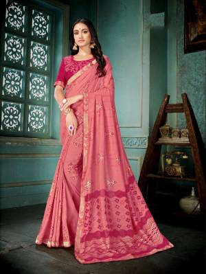 Enhance Your Personality Wearing This Pretty Designer Saree In Pink Color Paired With Dark Pink Colored Blouse. This Silk Based Saree Gives A Rich And Elegant Look To Your Personality. 