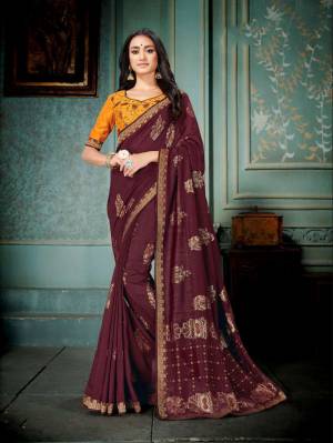 Grab This Saree For Your Semi-Casuals In Wine Color Paired With Musturd Yellow Colored Blouse. This Saree And Blouse are Silk Based Beautified With Prints And Thread Embroidery. It Is Light In Weight And Easy To Carry All Day Long. 