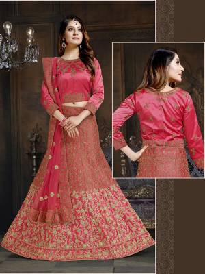 Shine Bright In This Attractive Looking Heavy Designer Lehenga Choli In Dark Pink Color. Its Blouse And Lehenga Are Satin Based Paired With Net Fabricated Dupatta. It Is Beautified With Heavy Coding And Stone Work. Buy Now.