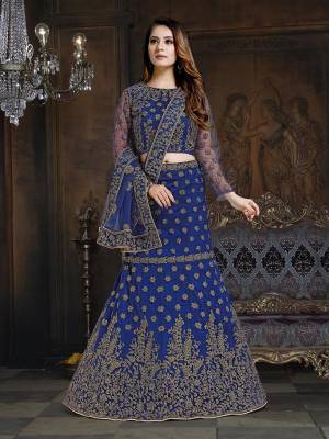 Here Is A Very Designer Lehenga Choli To Add Into Your Wardrobe For The Upcoming Wedding Season In Royal Blue. Its Pretty Blouse And Lehenga Are Fabricated On Net With Satin Inner Paired With Net Fabricated Dupatta. Its Pretty Color And Heavy Embroidery Will Definitely Earn You Lots Of Compliments From Onlookers. 