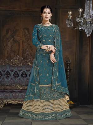 Shine Bright In This Attractive Looking Heavy Designer Lehenga Choli In Blue Color. Its Blouse And Lehenga Are Satin Based Paired With Net Fabricated Dupatta. It Is Beautified With Heavy Coding And Stone Work. Buy Now.