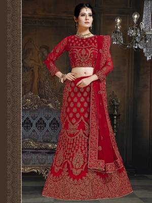 Here Is A Very Designer Lehenga Choli To Add Into Your Wardrobe For The Upcoming Wedding Season In Red. Its Pretty Blouse And Lehenga Are Fabricated On Net With Satin Inner Paired With Net Fabricated Dupatta. Its Pretty Color And Heavy Embroidery Will Definitely Earn You Lots Of Compliments From Onlookers. 