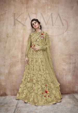 Flaunt Your Rich And Rich And Elegant Taste Wearing This Designer Heavy Floor Length Suit In All Over Pear Green. Its Heavy Embroidered Top Is Fabricated On Net Paired With Satin Silk Bottom And Net Fabricated Dupatta. Its Attractive Embroidery, Subtle Color And Designer Look Will Earn You Lots Of Compliments From Onlookers. 