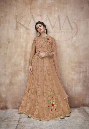 Flaunt Your Rich And Rich And Elegant Taste Wearing This Designer Heavy Floor Length Suit In All Over Orange. Its Heavy Embroidered Top Is Fabricated On Net Paired With Satin Silk Bottom And Net Fabricated Dupatta. Its Attractive Embroidery, Subtle Color And Designer Look Will Earn You Lots Of Compliments From Onlookers. 