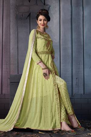 A Must Have Shade In Every Womens Wardrobe Is Here With This Designer Suit In Light Green Color. Its Heavy Embroidered Top Is Fabricated On Georgette Paired With Jacquard Silk Bottom And Chiffon Fabricated Dupatta. Its Lovely Front Slit Pattern Will Give An Enhanced Look To Your Personality. 