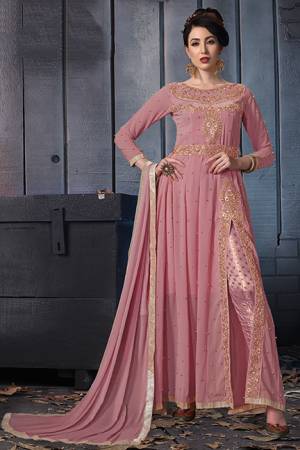 A Must Have Shade In Every Womens Wardrobe Is Here With This Designer Suit In Pink Color. Its Heavy Embroidered Top Is Fabricated On Georgette Paired With Jacquard Silk Bottom And Chiffon Fabricated Dupatta. Its Lovely Front Slit Pattern Will Give An Enhanced Look To Your Personality. 