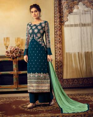 Grab This Very Beautiful Designer Heavy Embroidered Straight Suit In Blue Color Paired With Contrasting Sea Green Colored Dupatta. Its Heavy Embroidered Top Is Fabricated On Georgette Paired With Santoon Bottom And Chiffon Fabricated Dupatta. 
