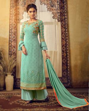 You Will Definitely Earn Lots Of Compliments Wearing This Heavy Designer Suit In Turquoise Blue Color Paired With Turquoise Blue Colored Bottom And Dupatta. Its Top Is Fabricated On Georgette Beautified With Heavy Embroidery Paired With Santoon Bottom And Chiffon Fabricated Dupatta. 