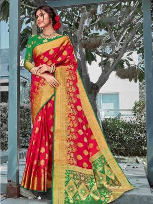 You Will Deinitely Earn Lots Of Compliments In This Beautiful Traditional Look With Silk Based Saree In Red Color Paired With Contrasting Green Colored Blouse. This Saree And Blouse Are Fabricated On Art Silk Beautified With Weave All Over. 
