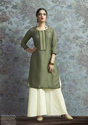 Here Is New And Unqiue With This Designer Semi-Stitched Kurti With Bottom In Indo-Western Wear. Its Pretty Modal Satin Fabricated Kurti Is In Olive Green Color Paired With Off-White Colored Unstitched Cotton Fabricated Bottom. 