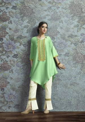 Here Is New And Unqiue With This Designer Semi-Stitched Kurti With Bottom In Indo-Western Wear. Its Pretty Modal Satin Fabricated Kurti Is In Light Green Color Paired With Off-White Colored Unstitched Cotton Fabricated Bottom. 
