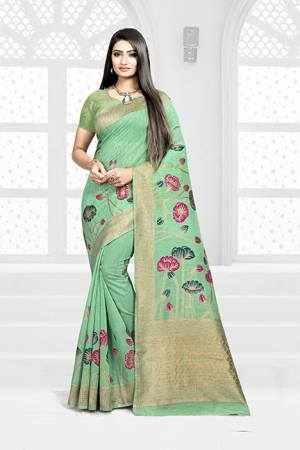 Look Pretty In This Designer Silk Based Green Colored Floral Saree Paired With Green Colored Blouse. This Saree Is Fabricated On Weaving Silk Paired With Art Silk Fabricated Blouse. Buy This Saree Now.