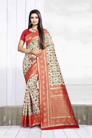 Celebrate This Festive Season With Beauty And Comfort Wearing This Designer Silk Based Saree In Cream Color Paired With Red Colored Blouse. This Saree Is Weaving Silk Based Paired With Art Silk Fabricated Blouse. It Will Give A Proper Traditional Look To Your Personality. 