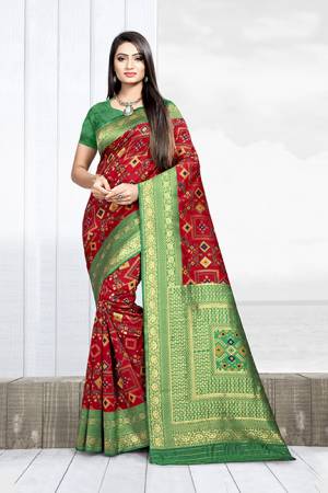 Grab This Rich Saree In Red Color Paired With Contrasting Green Colored Blouse. This Saree Is Fabricated On Weaving Silk Paired With Art Silk Fabricated Blouse. 