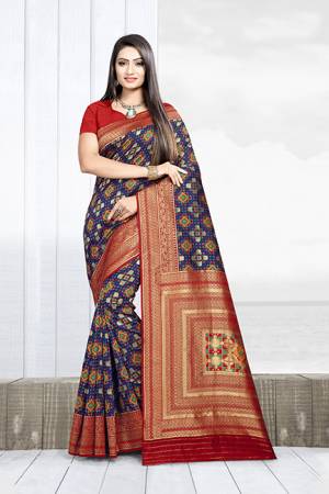 Celebrate This Festive Season With Beauty And Comfort Wearing This Designer Silk Based Saree In Navy Blue Color Paired With Red Colored Blouse. This Saree Is Weaving Silk Based Paired With Art Silk Fabricated Blouse. It Will Give A Proper Traditional Look To Your Personality. 