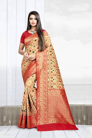 Grab This Rich Saree In Cream Color Paired With Contrasting Red Colored Blouse. This Saree Is Fabricated On Weaving Silk Paired With Art Silk Fabricated Blouse. 