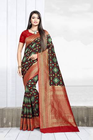 Celebrate This Festive Season With Beauty And Comfort Wearing This Designer Silk Based Saree In Black Color Paired With Red Colored Blouse. This Saree Is Weaving Silk Based Paired With Art Silk Fabricated Blouse. It Will Give A Proper Traditional Look To Your Personality. 