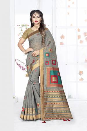 Here Is A Very Pretty Silk Based Saree In Dark Grey Color. This Saree Is Fabricated On Weaving Silk Paired With Art Silk Fabricated Blouse. It Is Light In Weight And Easy To Carry All Day Long. 
