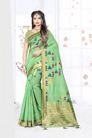 Here Is A Very Pretty Silk Based Saree In Green Color. This Saree Is Fabricated On Weaving Silk Paired With Art Silk Fabricated Blouse. It Is Light In Weight And Easy To Carry All Day Long. 