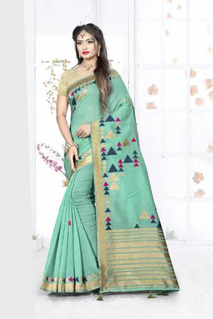 Here Is A Very Pretty Silk Based Saree In Sea Green Color. This Saree Is Fabricated On Weaving Silk Paired With Art Silk Fabricated Blouse. It Is Light In Weight And Easy To Carry All Day Long. 